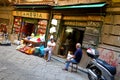 Shop sellers chat in La Vucciria, the famous Market, Palermo Sicily